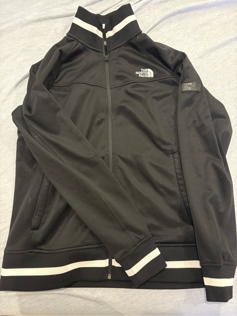The North Face Black Track-Style Zip Jacket with White Stripe